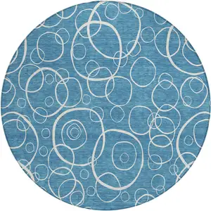 Photo of 8' Teal Blue And Ivory Round Geometric Washable Indoor Outdoor Area Rug