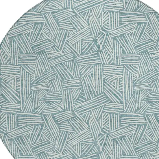 8' Teal Blue And Ivory Round Geometric Washable Indoor Outdoor Area Rug Photo 4