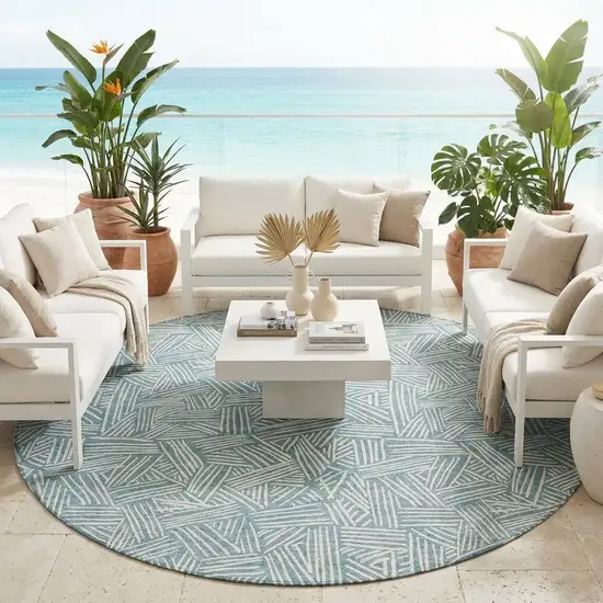 8' Teal Blue And Ivory Round Geometric Washable Indoor Outdoor Area Rug Photo 1