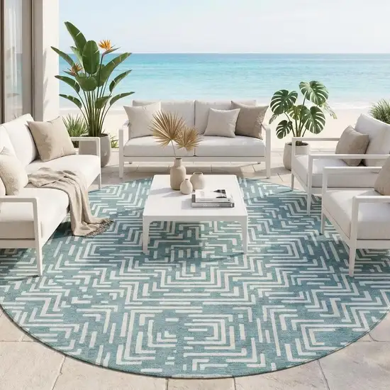 8' Teal Blue And Ivory Round Geometric Washable Indoor Outdoor Area Rug Photo 1