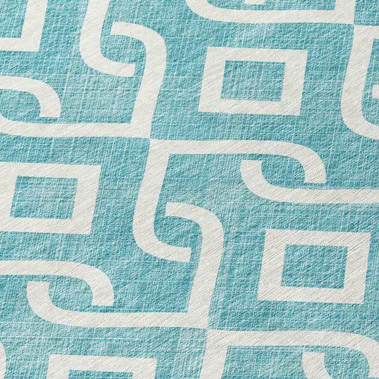 8' Teal Blue And Ivory Round Geometric Washable Indoor Outdoor Area Rug Photo 7