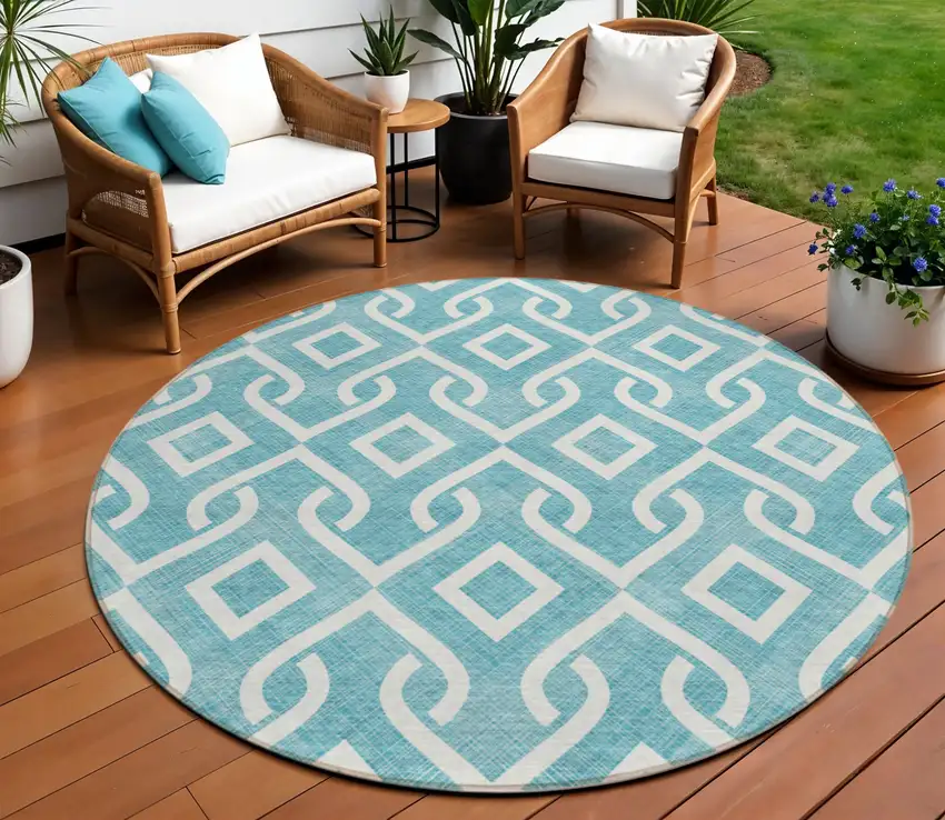 8' Teal Blue And Ivory Round Geometric Washable Indoor Outdoor Area Rug Photo 1