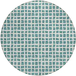 Photo of 8' Teal Blue And Ivory Round Geometric Washable Indoor Outdoor Area Rug