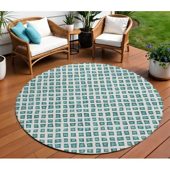 8' Teal Blue And Ivory Round Geometric Washable Indoor Outdoor Area Rug Photo 1