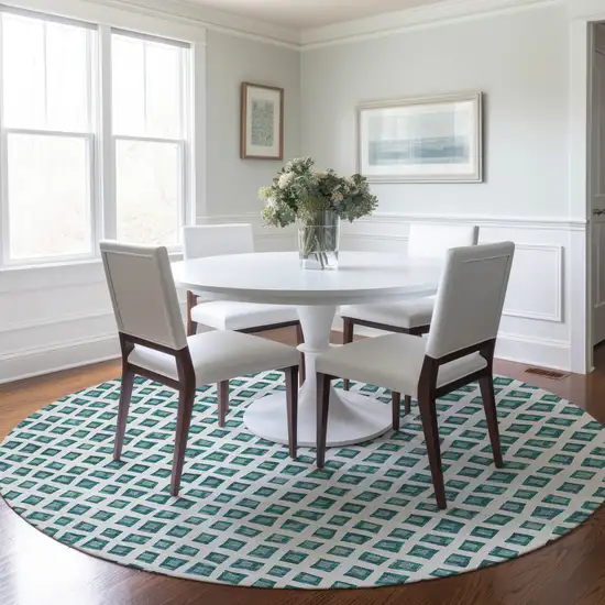 8' Teal Blue And Ivory Round Geometric Washable Indoor Outdoor Area Rug Photo 9