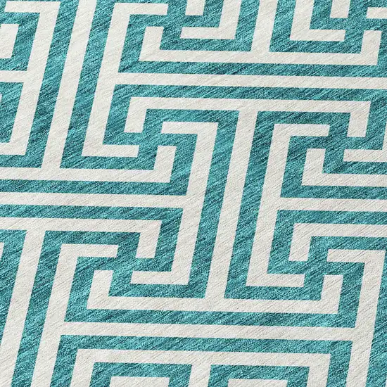 8' Teal Blue And Ivory Round Geometric Washable Indoor Outdoor Area Rug Photo 4
