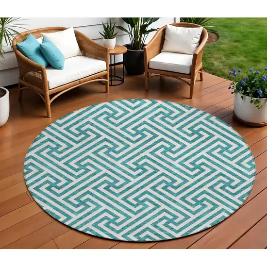 8' Teal Blue And Ivory Round Geometric Washable Indoor Outdoor Area Rug Photo 1