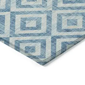 Photo of 8' Teal Blue And Ivory Round Geometric Washable Indoor Outdoor Area Rug