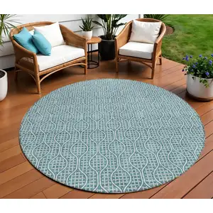 Photo of 8' Teal Blue And Ivory Round Geometric Washable Indoor Outdoor Area Rug