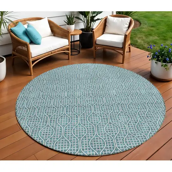 8' Teal Blue And Ivory Round Geometric Washable Indoor Outdoor Area Rug Photo 1
