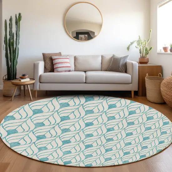 8' Teal Blue And Ivory Round Geometric Washable Indoor Outdoor Area Rug Photo 7