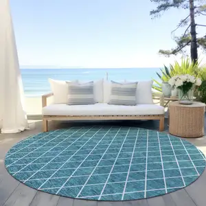 Photo of 8' Teal Blue And Ivory Round Geometric Washable Indoor Outdoor Area Rug