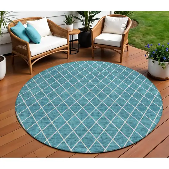 8' Teal Blue And Ivory Round Geometric Washable Indoor Outdoor Area Rug Photo 1