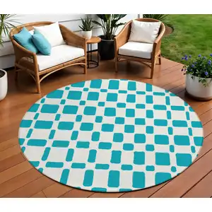 Photo of 8' Teal Blue And Ivory Round Geometric Washable Indoor Outdoor Area Rug