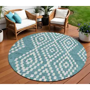 Photo of 8' Teal Blue And Ivory Round Geometric Washable Indoor Outdoor Area Rug