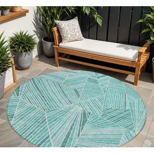 Photo of 8' Teal Blue And Ivory Round Geometric Washable Indoor Outdoor Area Rug