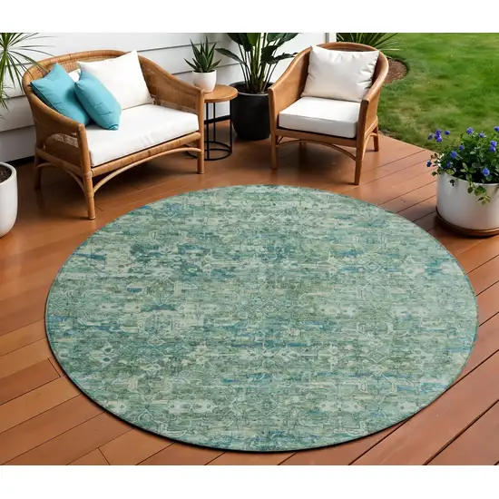 8' Teal Blue And Ivory Round Ikat Washable Indoor Outdoor Area Rug Photo 1