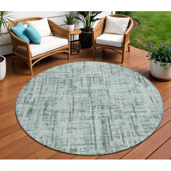 8' Teal Blue And Ivory Round Striped Washable Indoor Outdoor Area Rug Photo 2