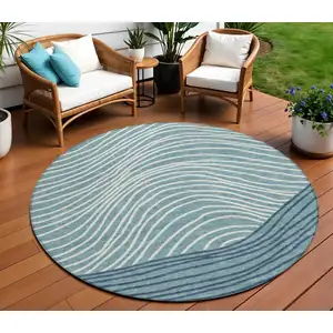 Photo of 8' Teal Blue And Ivory Round Striped Washable Indoor Outdoor Area Rug