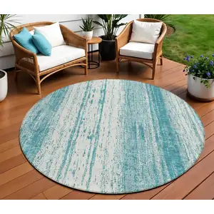 Photo of 8' Teal Blue And Ivory Round Striped Washable Indoor Outdoor Area Rug