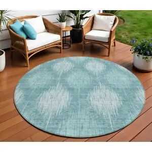 Photo of 8' Teal Blue And Mint Green Round Ikat Washable Indoor Outdoor Area Rug