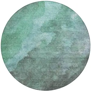 Photo of 8' Teal Blue And Pale Aqua Round Abstract Washable Indoor Outdoor Area Rug