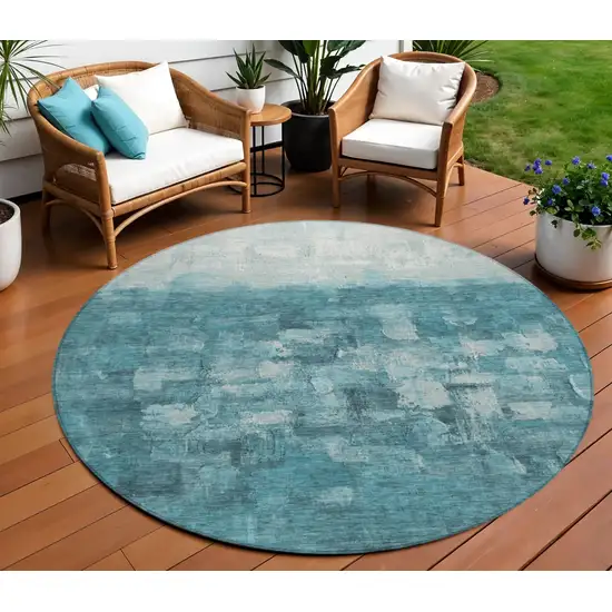 8' Teal Blue And Silver Round Abstract Washable Indoor Outdoor Area Rug Photo 1