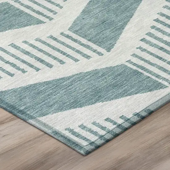 8' Teal Blue And Silver Round Geometric Washable Indoor Outdoor Area Rug Photo 4