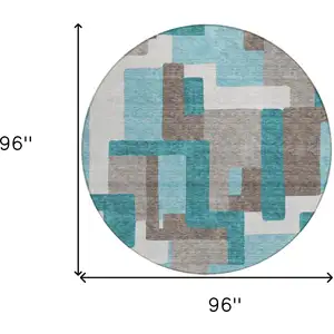 Photo of 8' Teal Blue Aqua And Beige Round Abstract Washable Indoor Outdoor Area Rug