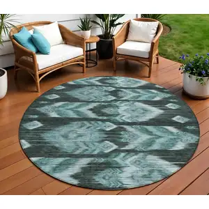 Photo of 8' Teal Blue Aqua And Charcoal Round Southwestern Washable Indoor Outdoor Area Rug