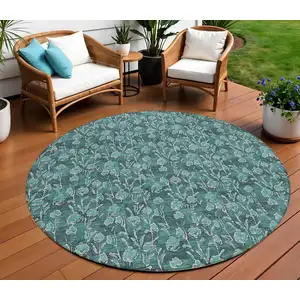 Photo of 8' Teal Blue Aqua And Ivory Round Floral Washable Indoor Outdoor Area Rug
