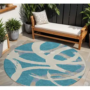 Photo of 8' Teal Blue Beige And Gray Round Abstract Washable Indoor Outdoor Area Rug