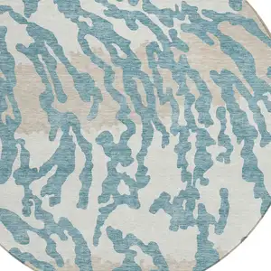 Photo of 8' Teal Blue Beige And Ivory Round Animal Print Washable Indoor Outdoor Area Rug