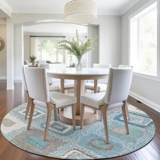 8' Teal Blue Beige And Ivory Round Geometric Washable Indoor Outdoor Area Rug Photo 6