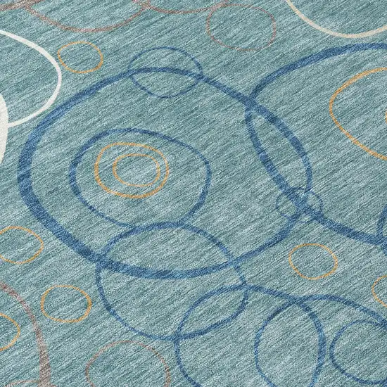 8' Teal Blue Beige And Ivory Round Geometric Washable Indoor Outdoor Area Rug Photo 9