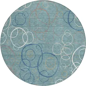 Photo of 8' Teal Blue Beige And Ivory Round Geometric Washable Indoor Outdoor Area Rug