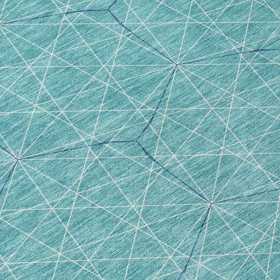 8' Teal Blue Black And Ivory Round Geometric Washable Indoor Outdoor Area Rug Photo 8
