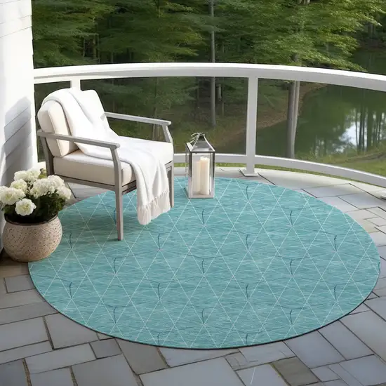 8' Teal Blue Black And Ivory Round Geometric Washable Indoor Outdoor Area Rug Photo 6