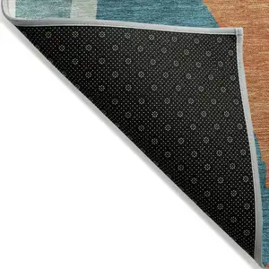 Photo of 8' Teal Blue Copper And Ivory Round Abstract Washable Indoor Outdoor Area Rug
