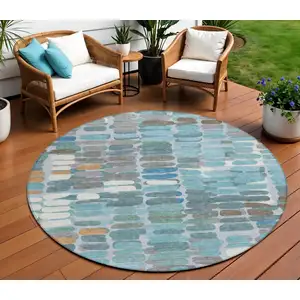 Photo of 8' Teal Blue Copper And Ivory Round Abstract Washable Indoor Outdoor Area Rug