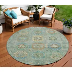 Photo of 8' Teal Blue Gold And Copper Round Medallion Washable Indoor Outdoor Area Rug