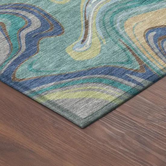 8' Teal Blue Gold And Ivory Round Abstract Washable Indoor Outdoor Area Rug Photo 8