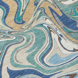 Photo of 8' Teal Blue Gold And Ivory Round Abstract Washable Indoor Outdoor Area Rug