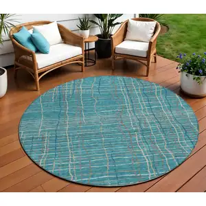 Photo of 8' Teal Blue Gray And Brown Round Striped Washable Indoor Outdoor Area Rug