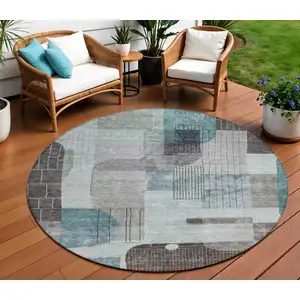 Photo of 8' Teal Blue Gray And Charcoal Round Abstract Washable Indoor Outdoor Area Rug