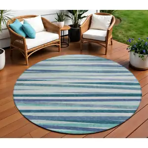 Photo of 8' Teal Blue Gray And Ivory Round Striped Washable Indoor Outdoor Area Rug