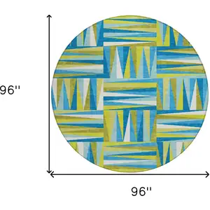 Photo of 8' Teal Blue Green And Ivory Round Geometric Washable Indoor Outdoor Area Rug
