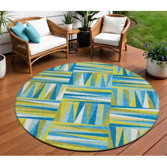 8' Teal Blue Green And Ivory Round Geometric Washable Indoor Outdoor Area Rug Photo 1