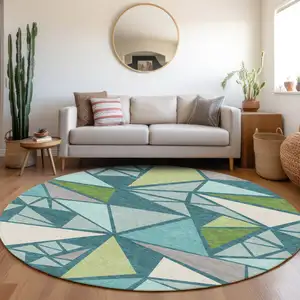 Photo of 8' Teal Blue Green And Ivory Round Geometric Washable Indoor Outdoor Area Rug