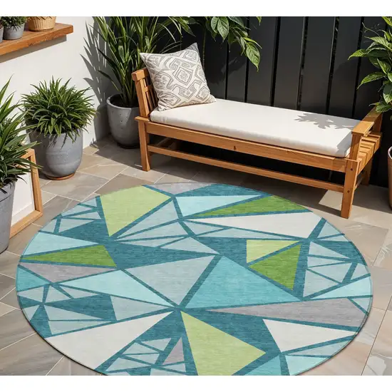 8' Teal Blue Green And Ivory Round Geometric Washable Indoor Outdoor Area Rug Photo 1